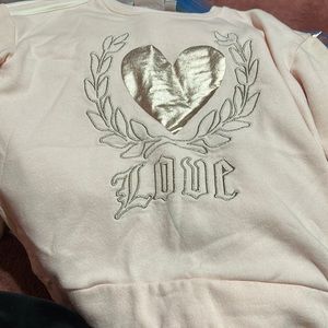 A girls long sleeve sweater